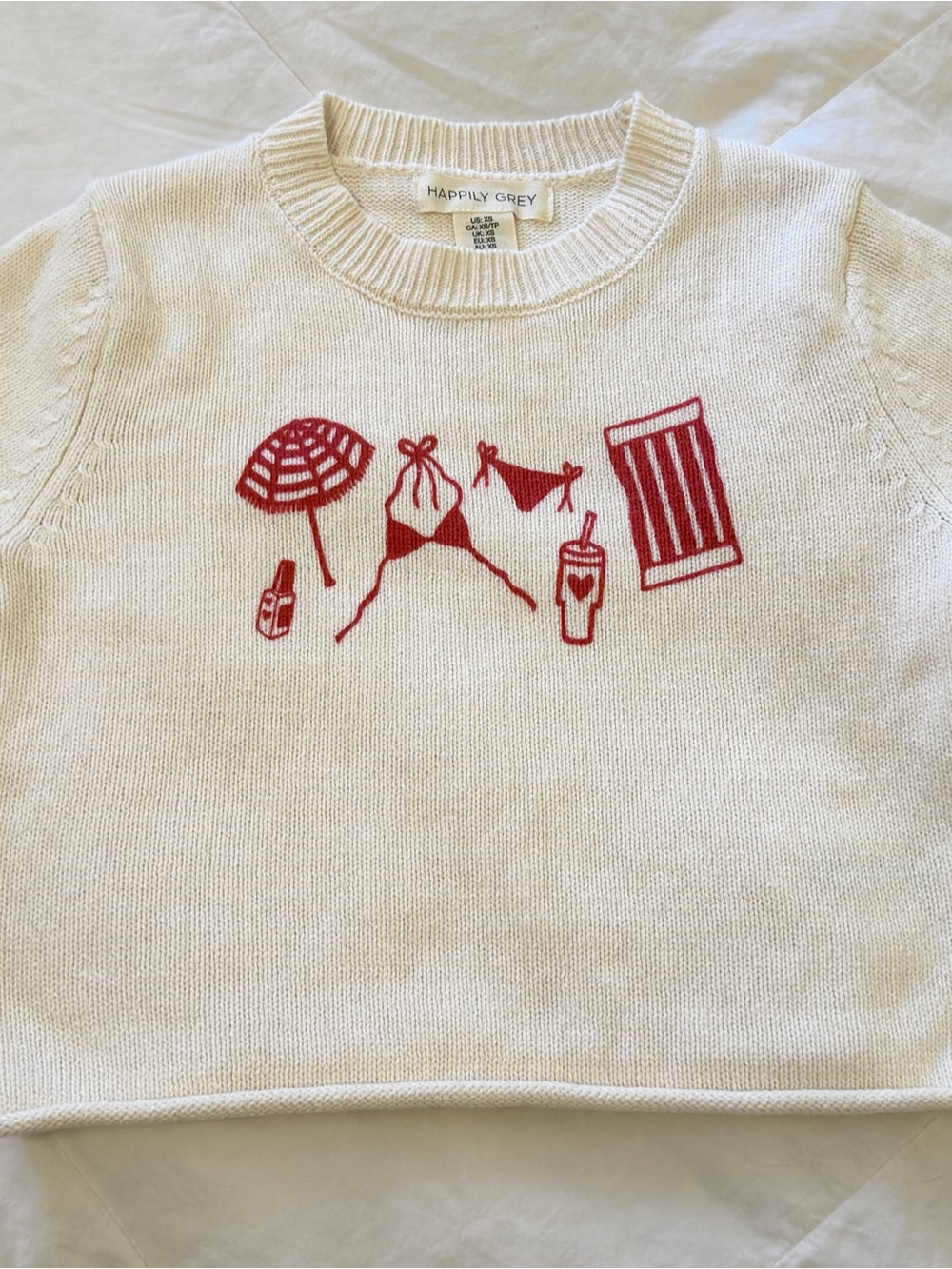 Happily Grey Women's Cream Crewneck Sweater with Red Beach Graphics